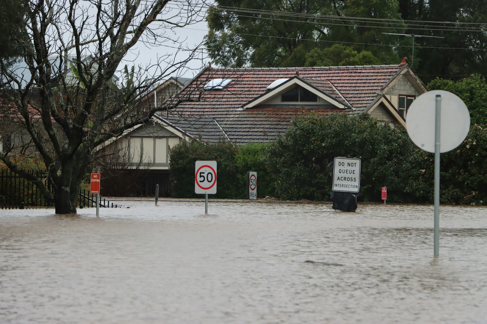 a house with a sign in front of it, home